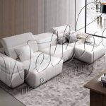 Sofa with ottoman in the interior: ideas for inspiration