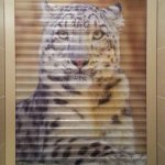 Image of a tiger on the roller shutters in the toilet