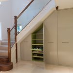 Built-in wardrobe under the stairs: installation and filling features